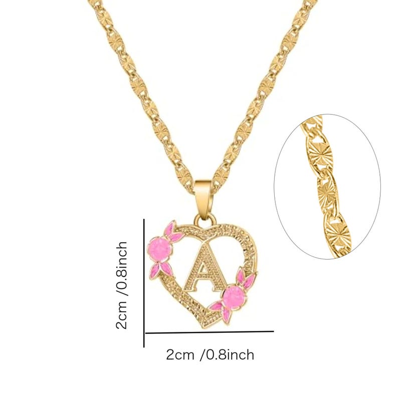 May include: Gold chain necklace with a heart-shaped pendant featuring the letter 'A' with pink enamel flowers. The pendant measures 2 cm in diameter.