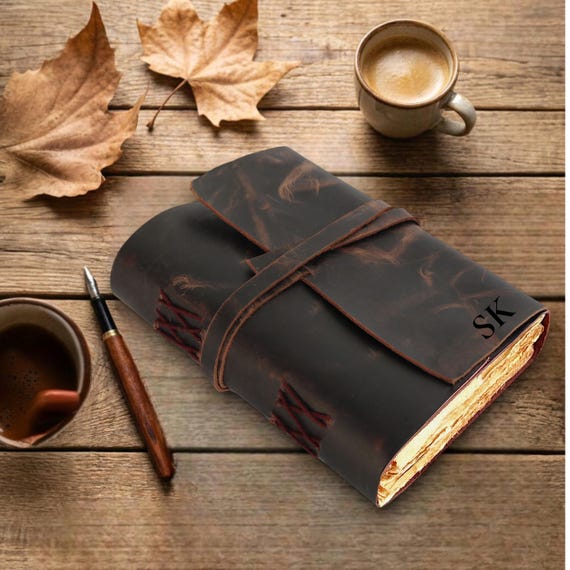 Custom-engraved deckle edge paper Book of Shadows with personalized spell-book energy — the full package for a fantasy or witchcraft enthusiast.