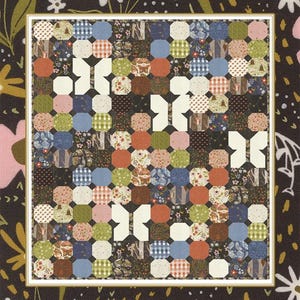 May include: A patchwork quilt with a butterfly design, featuring octagonal shapes in various patterns and colors like blue, orange, and green. The text "Boho Butterfly" and "by Coach House Designs" are displayed on the quilt.