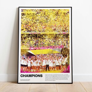 May include: A framed poster with the word "CHAMPIONS" in large white letters. The image shows a team celebrating a victory, with confetti and a banner. The background is a stadium filled with spectators.