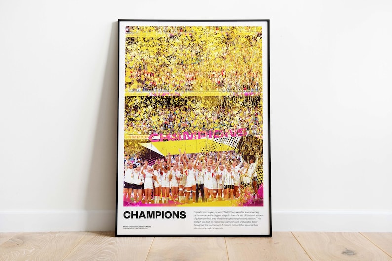 May include: A framed poster with the word "CHAMPIONS" in large white letters. The image shows a team celebrating a victory, with confetti and a banner. The background is a stadium filled with spectators.