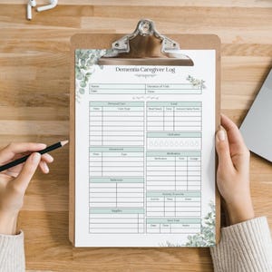 May include: A printable dementia caregiver log with sections for personal care, housework, bathing, supplies, medication, hydration, food, and social visits. The log is decorated with a green floral design.