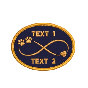 May include: An oval-shaped embroidered patch with a navy blue background and a gold border. The patch features a gold infinity symbol with two paw prints and a heart at the bottom. The text "TEXT 1" is above the infinity symbol and "TEXT 2" is below.