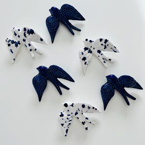 Ceramic swallows made in Portugal and painted by hand. Glazed Portuguese ceramics. Sign of joy and happiness. Good for gift. Living wall art