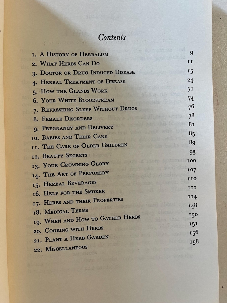 May include: Open book page with a table of contents titled "Contents". The list includes topics such as herbalism, herbal treatments, and herbal beverages. The page numbers are listed to the right of each topic.