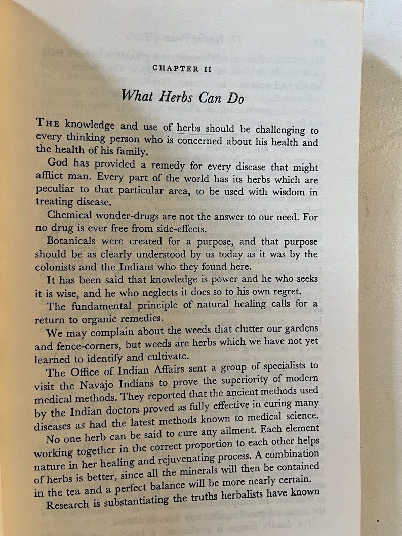 May include: Open book page with the title "What Herbs Can Do" and text discussing the use of herbs for health and healing. The text is in black font on a cream-colored paper.