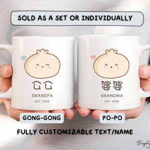May include: Two white ceramic mugs featuring dumpling illustrations and the words "Grandpa" and "Grandma". Each mug has a heart and the text "EST. 2026". The mugs are labeled "GONG-GONG" and "PO-PO". The text "SOLD AS A SET OR INDIVIDUALLY" is also visible.