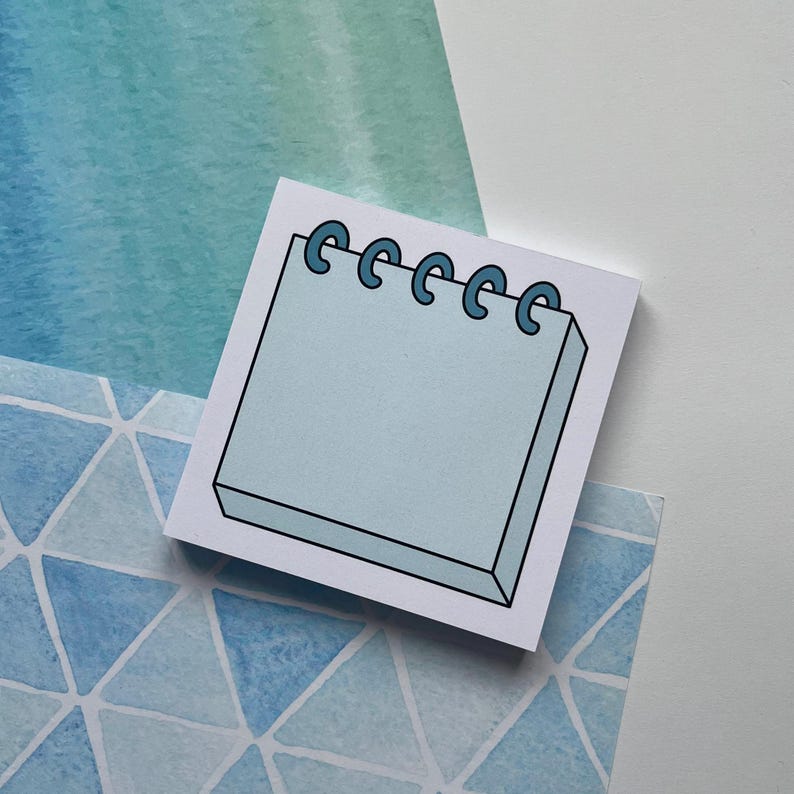 May include: A light blue notepad with a spiral binding. The notepad is on a blue and white watercolor background.