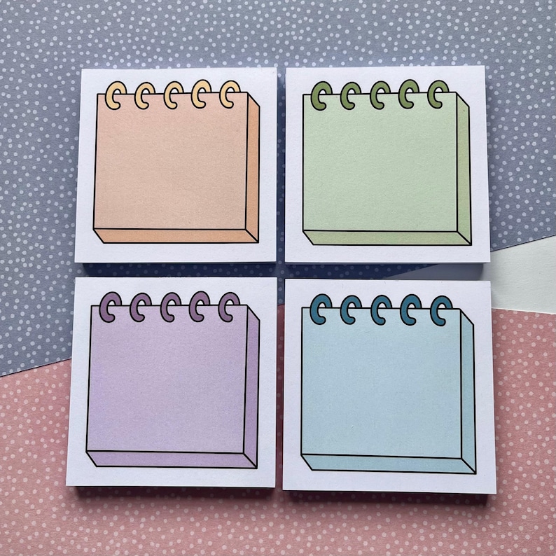 May include: Four square sticky notes with a spiral binding. The notes are in different colors: peach, light green, lavender, and light blue.