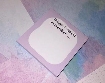 May include: A square, lavender sticky note with rounded edges and the text "Things I should remember..." in black. The note has a white, irregular-shaped space for writing. The background features a pastel color palette.