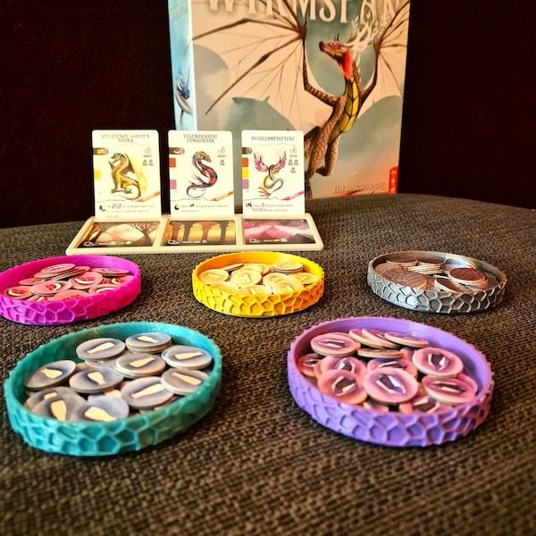 Wyrmspan - Bowls with dragon motif and a card supply tableau for the dragon and cave cards
