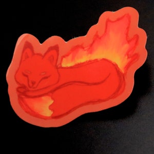May include: A red fox curled up with its tail wrapped around its body. The fox's tail is on fire, with flames in shades of orange and yellow.