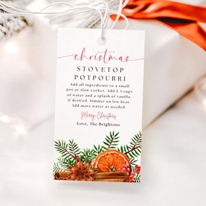 May include: A white gift tag with a red and black Christmas-themed design. The tag has the text "christmas STOVETOP POTPOURRI" and instructions for making a stovetop potpourri. The design includes a sprig of pine, cinnamon sticks, star anise, and orange slices.