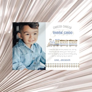 May include: A rectangular thank you card featuring a photograph of a young child on the left and a watercolor train illustration on the right. The text reads CHUGGA CHUGGA THANK CHOO, followed by a message of gratitude and LOVE, JACKSON at the bottom.