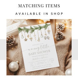 May include: A white baby shower invitation with a green garland of pine branches and ornaments. The text reads "Please join us for a merry little baby shower honouring the mommy to be Madeline Johnson.  October 21, 1:00 PM.  RSVP to [email protected] Registered at Amazon and Target."