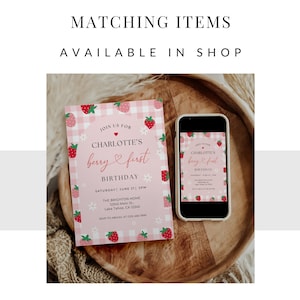 May include: A pink and white printable invitation with a strawberry and gingham pattern. The invitation says "Join us for Charlotte's berry first birthday" and includes the date, time, and location of the event.