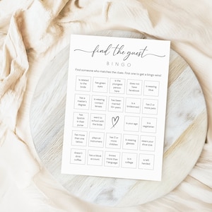 Photo shows bingo printable game laying flat on a board.
