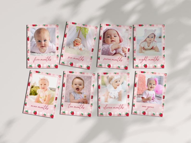 photo shows eight berry 1st birthday milestone cards laying flat on a table.