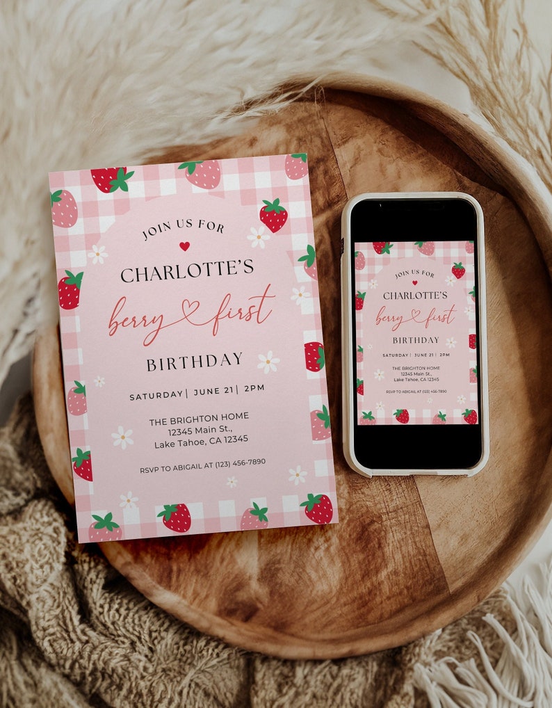 Berry first birthday invitation includes strawberries and daisies. Shown printed and as a digital invite.