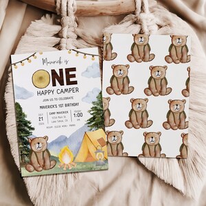 Photo shows the front and back of the one happy dude invitation card. The back of the card shows a repeated pattern of the brown bear wearing a green backpack.