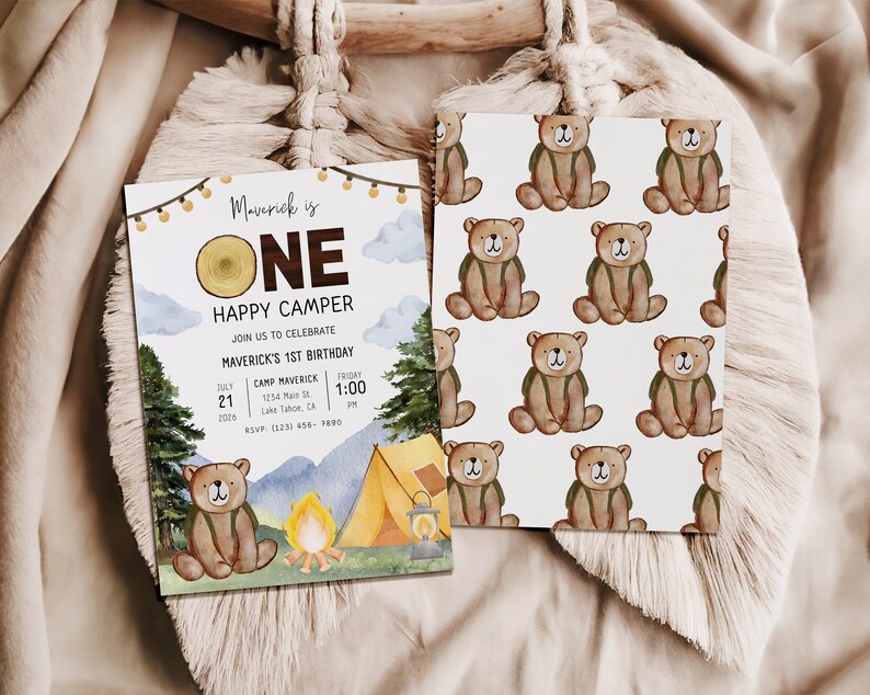 Photo shows the front and back of the one happy dude invitation card. The back of the card shows a repeated pattern of the brown bear wearing a green backpack.