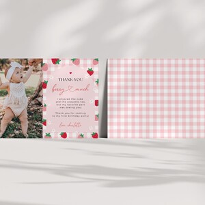 Strawberry first birthday thank you card shows the front and optional back side of the card. The back of the card is a pink gingham background.