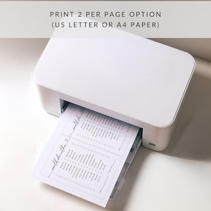 May include: A white printer with a sheet of paper coming out of the tray. The paper has a list of questions that say "would she rather" on it. The text at the top of the image says "PRINT 2 PER PAGE OPTION (US LETTER OR A4 PAPER)".