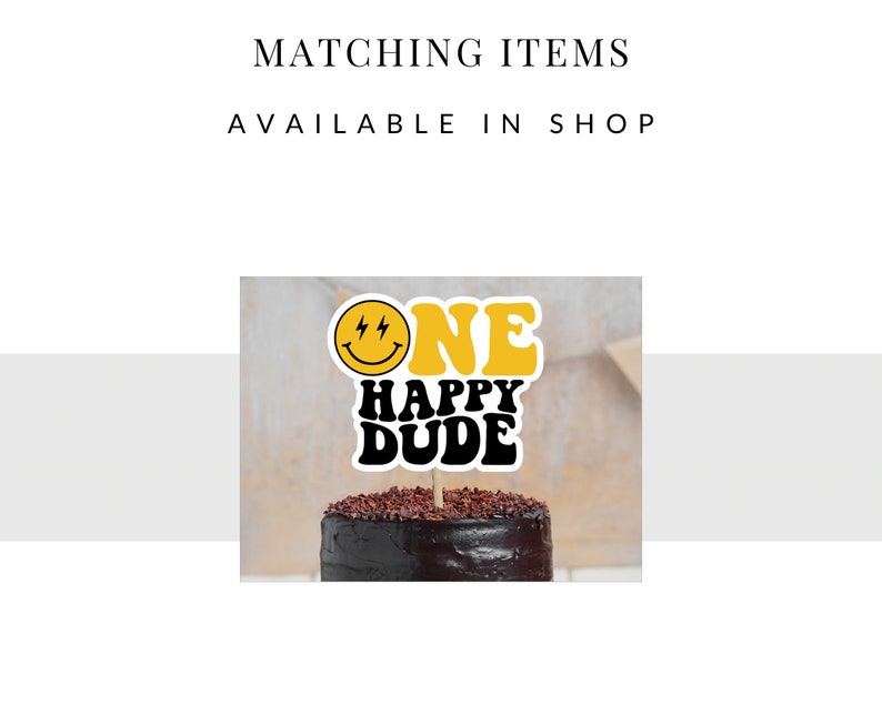 May include: A yellow and black cake topper with a smiley face and the text "ONE HAPPY DUDE" on a chocolate cake.