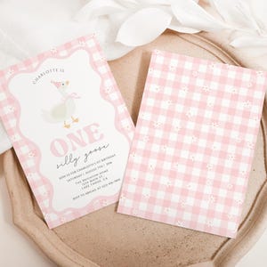May include: Two pink and white invitations with a whimsical design. One features a cartoon goose wearing a party hat and the text "ONE silly goose." The other has a pink gingham pattern with small white flowers.