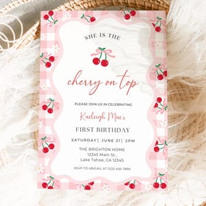 Cherry First Birthday Invitation shown laying and printed as a 5x7” card.