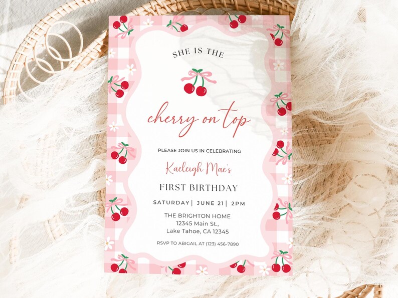 Cherry First Birthday Invitation shown laying and printed as a 5x7” card.