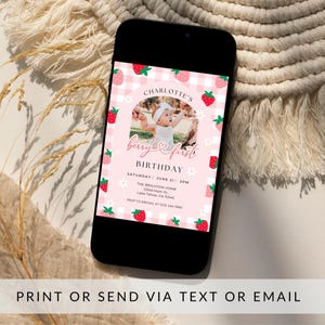 May include: A pink and white gingham patterned birthday invitation with a photo of a baby girl in a white dress. The invitation says "Charlotte's Berry & First Birthday" and includes the date, time, and location of the party.