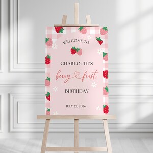 Berry first birthday welcome sign is shown printed as size 18x24” and placed on an easel.