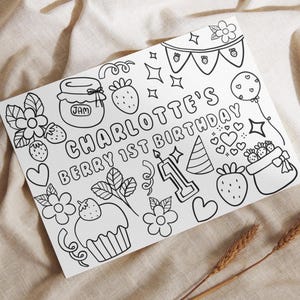 May include: A white rectangular colouring sheet featuring black line art illustrations of strawberries, flowers, a jar labelled JAM, a cupcake, a party hat, a balloon, and the text CHARLOTTE'S BERRY 1ST BIRTHDAY with a number one candle.