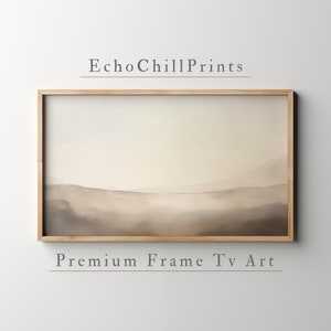 May include: A framed print of a landscape with a hazy, misty background in shades of brown and beige. The print is titled "EchoChillPrints" and is labelled "Premium Frame Tv Art".