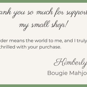 May include: A rectangular card with a green border and a cream-colored interior. The card features elegant script that reads "Thank you so much for supporting my small shop!" and a message from Kimberly of Bougie Mahjong.