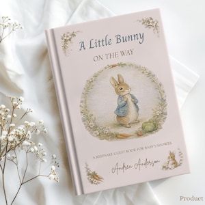 May include: A pink baby shower guest book with the title "A Little Bunny ON THE WAY". The cover features a watercolor illustration of a bunny in a blue jacket. The book measures 5.71" x 8".
