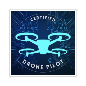 May include: A blue and white sticker with a circuit board background and a drone silhouette in the centre. The text "CERTIFIED DRONE PILOT" is written in a circle around the drone.