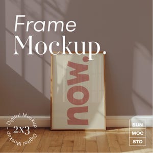 May include: A digital mockup of a framed print with the word "now" in pink letters on a white background. The frame is wooden and has a light brown finish. The print is hanging on a light brown wall with a white baseboard. The image is labeled "Frame Mockup - Digital Mockup - 2x3 - Digital Mockup".