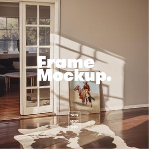 May include: A framed artwork featuring a cowboy on horseback, leaning against a wall. The frame is gold-colored. The image is in a room with a cowhide rug and a doorway. The text "Frame Mockup" is displayed in white.