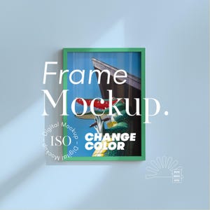 May include: A green framed art print with the text "Frame Mockup" in white. The artwork features a colorful sculpture of a crocodile. The words "CHANGE COLOR" are also visible. The frame is set against a light blue background.