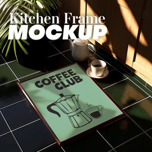 May include: A framed print with a green background and black text that says "Coffee Club". The print features a black and white illustration of a coffee pot and a coffee cup.