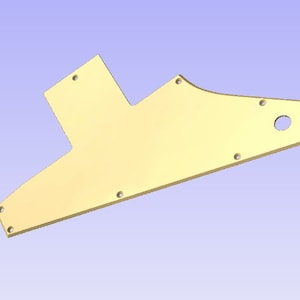 Op de afbeelding: Een gouden metalen gitaar pickguard met meerdere schroefgaten en een rond gat in de rechterbovenhoek.