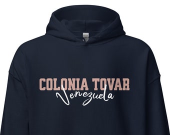 May include: Navy blue hooded sweatshirt with the text "COLONIA TOVAR Venezuela" in pink and white lettering.
