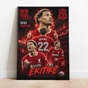 May include: A rectangular poster featuring multiple images of Hugo Ekitike in a red Liverpool Football Club kit. The design includes the number 22, the player's name, the Liverpool FC crest, and a stadium background in shades of red and black.