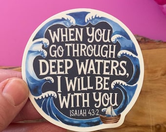 May include: A blue and white sticker with a quote from Isaiah 43:2, "When you go through deep waters, I will be with you." The sticker features a stylized image of waves and a small sailboat.