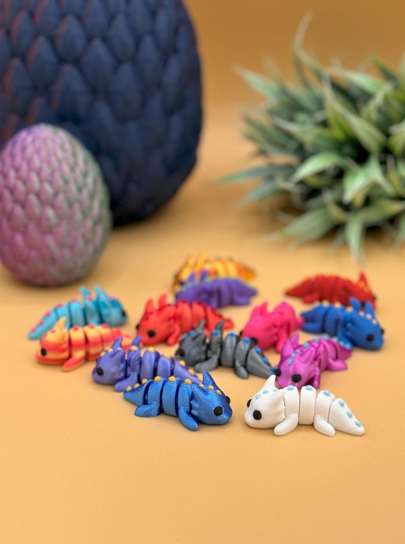 3D printed miniature dragon fidget and sensory toy bundle.