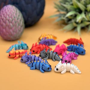 3D printed dragon fidget and sensory toys.