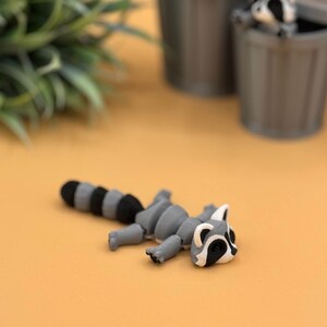 Adorable baby raccoon 3D printed toy.