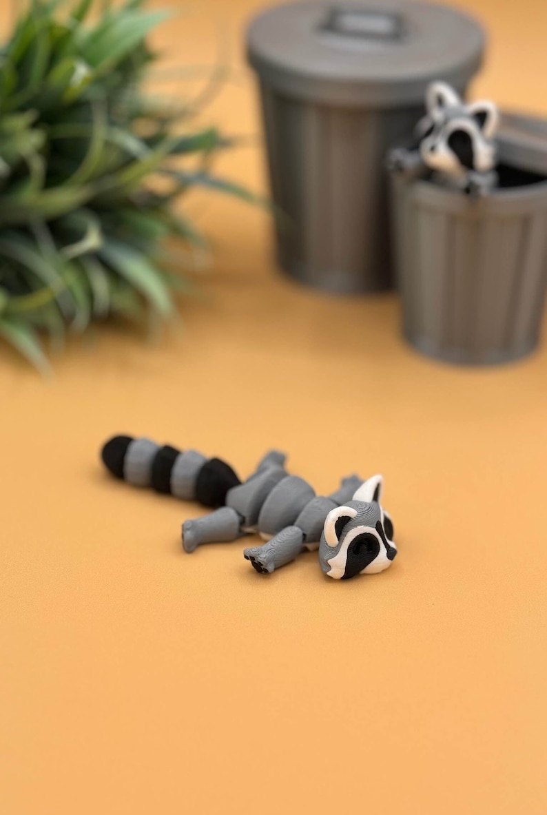 Adorable baby raccoon 3D printed toy.